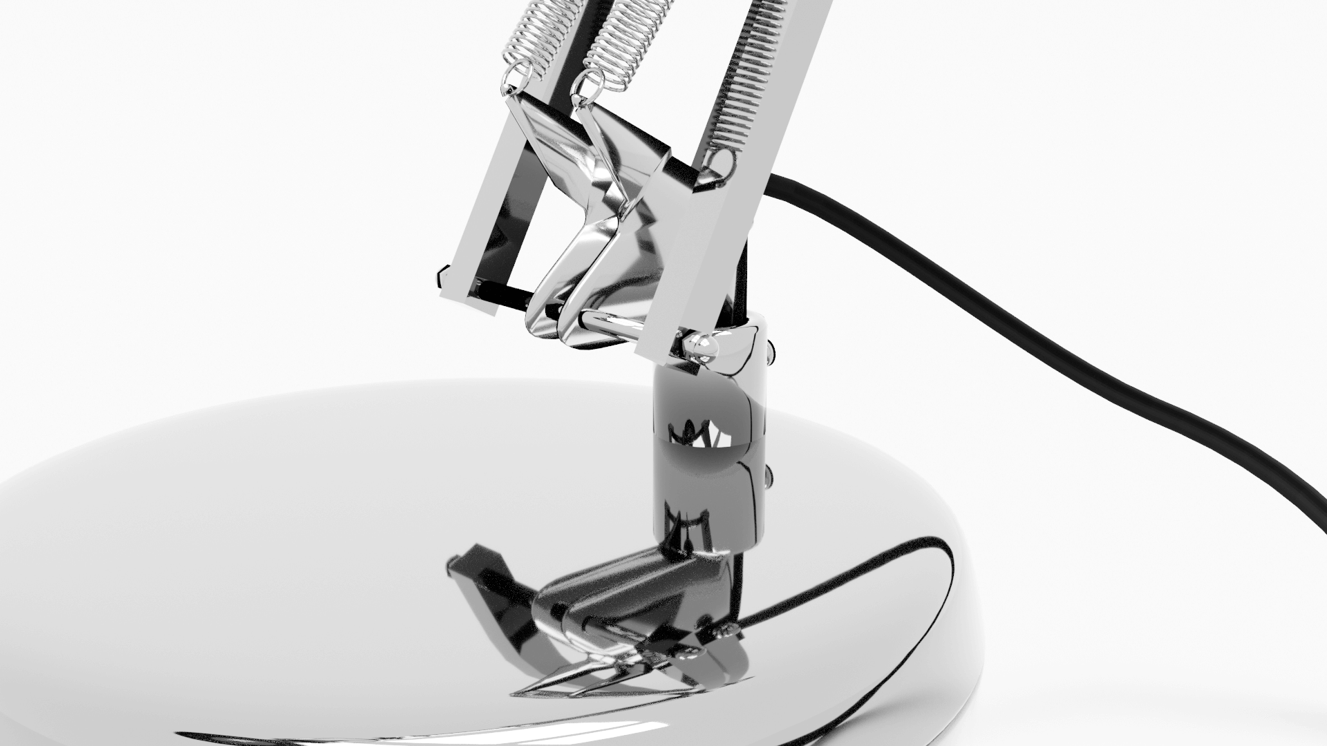 Macro — springs, screws and the pivot joint above the base.